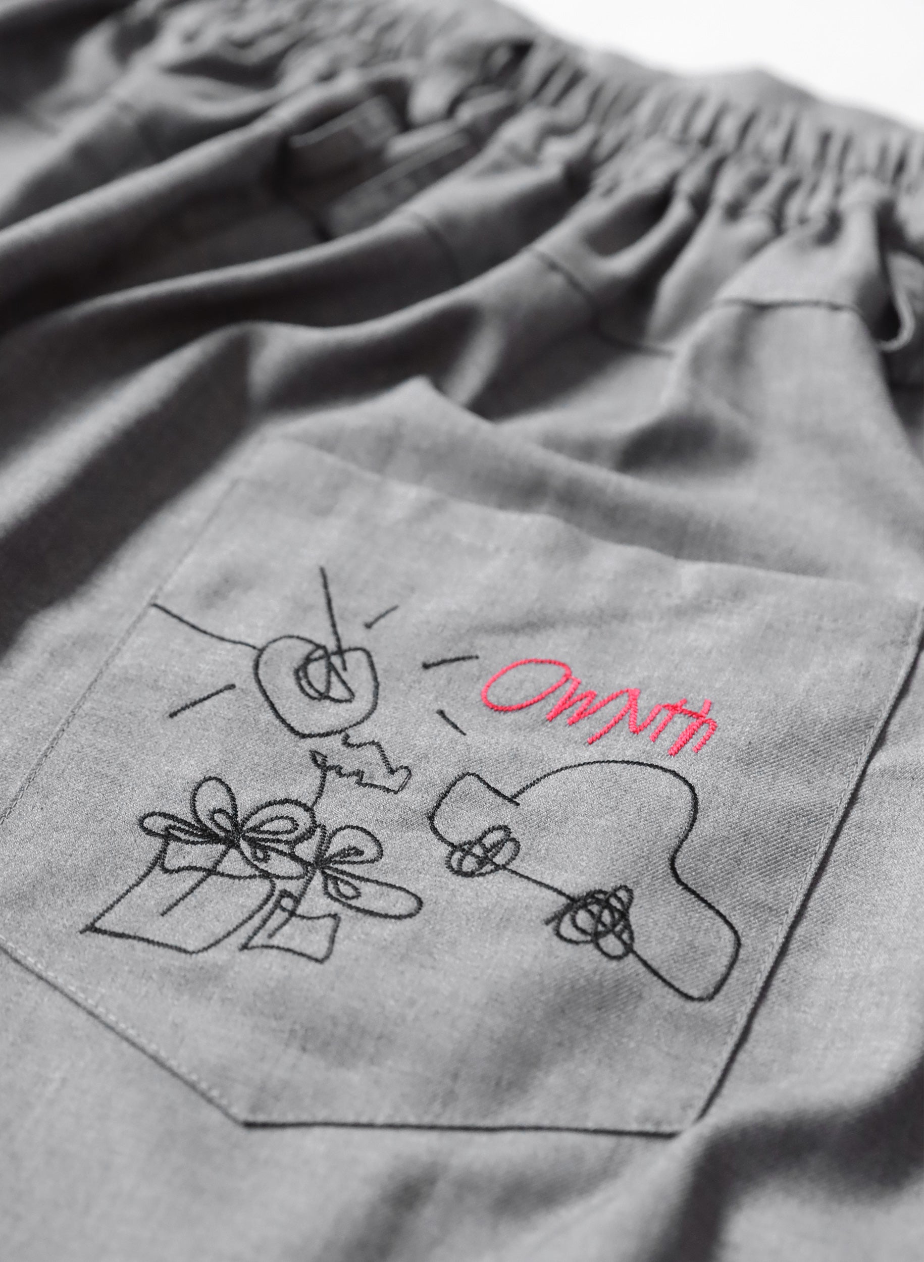 OWNth(オンス) バック刺繍アシメプリーツスカート きれいめ レディース　刺繍ロゴ
